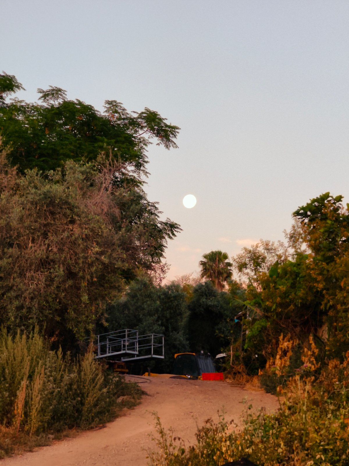 Full moon rises over Lachish Regional Council at twilight