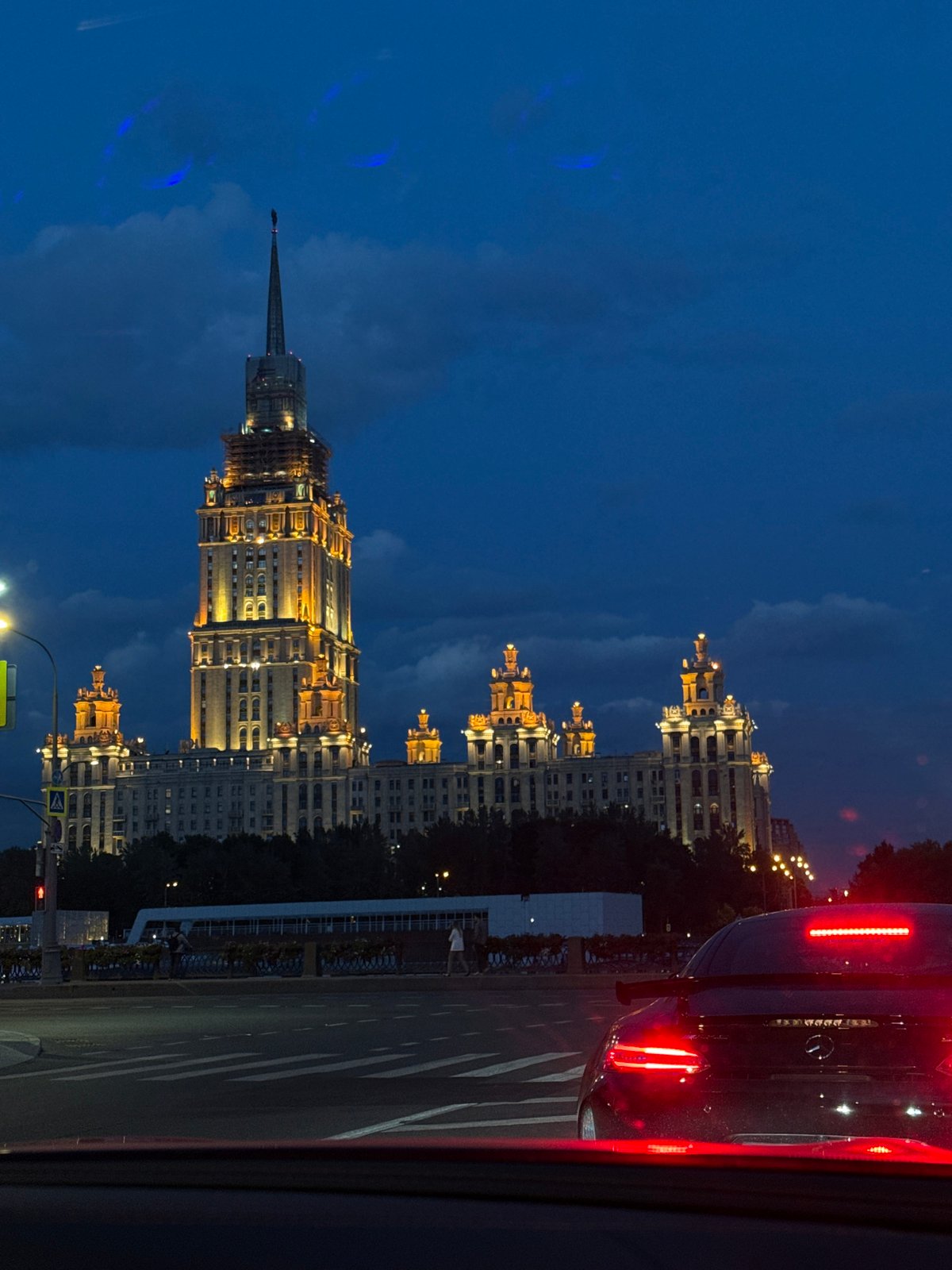 Moscow's iconic Stalinist skyscraper illuminated against evening sky
