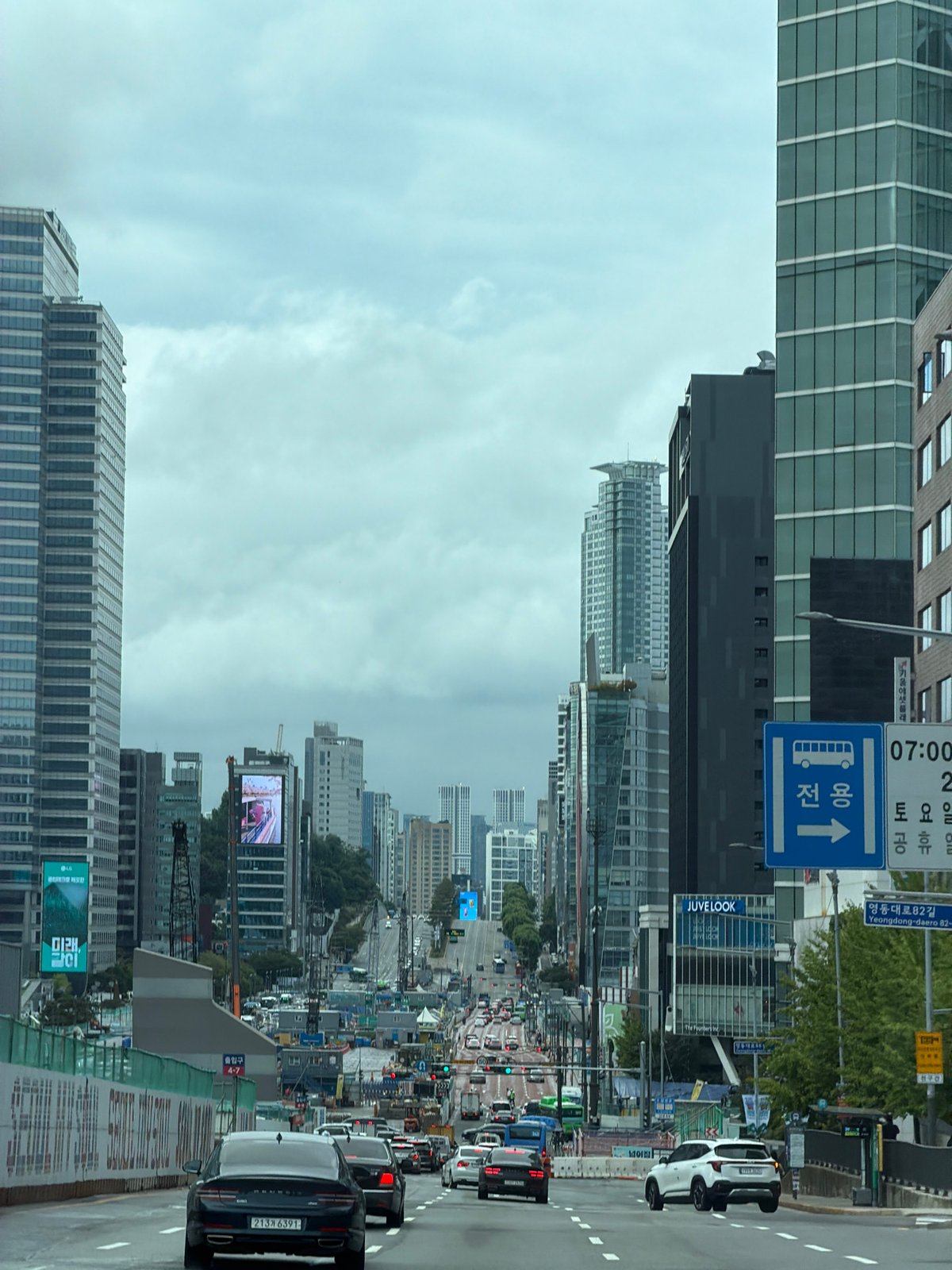 Glass towers and wide streets on a cloudy Seoul morning
