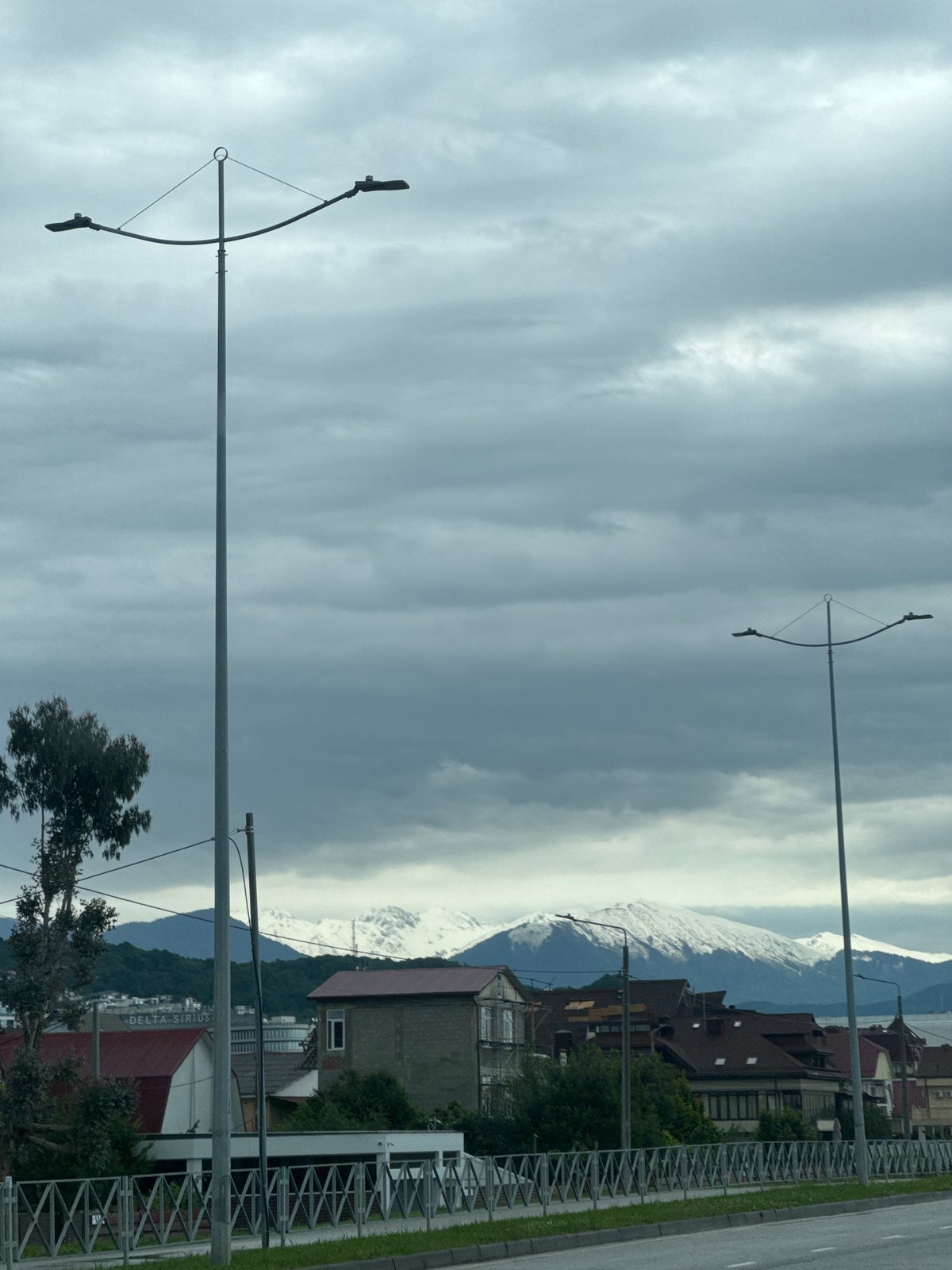 Wet streets, curved streetlights observed in Sirius, Russia