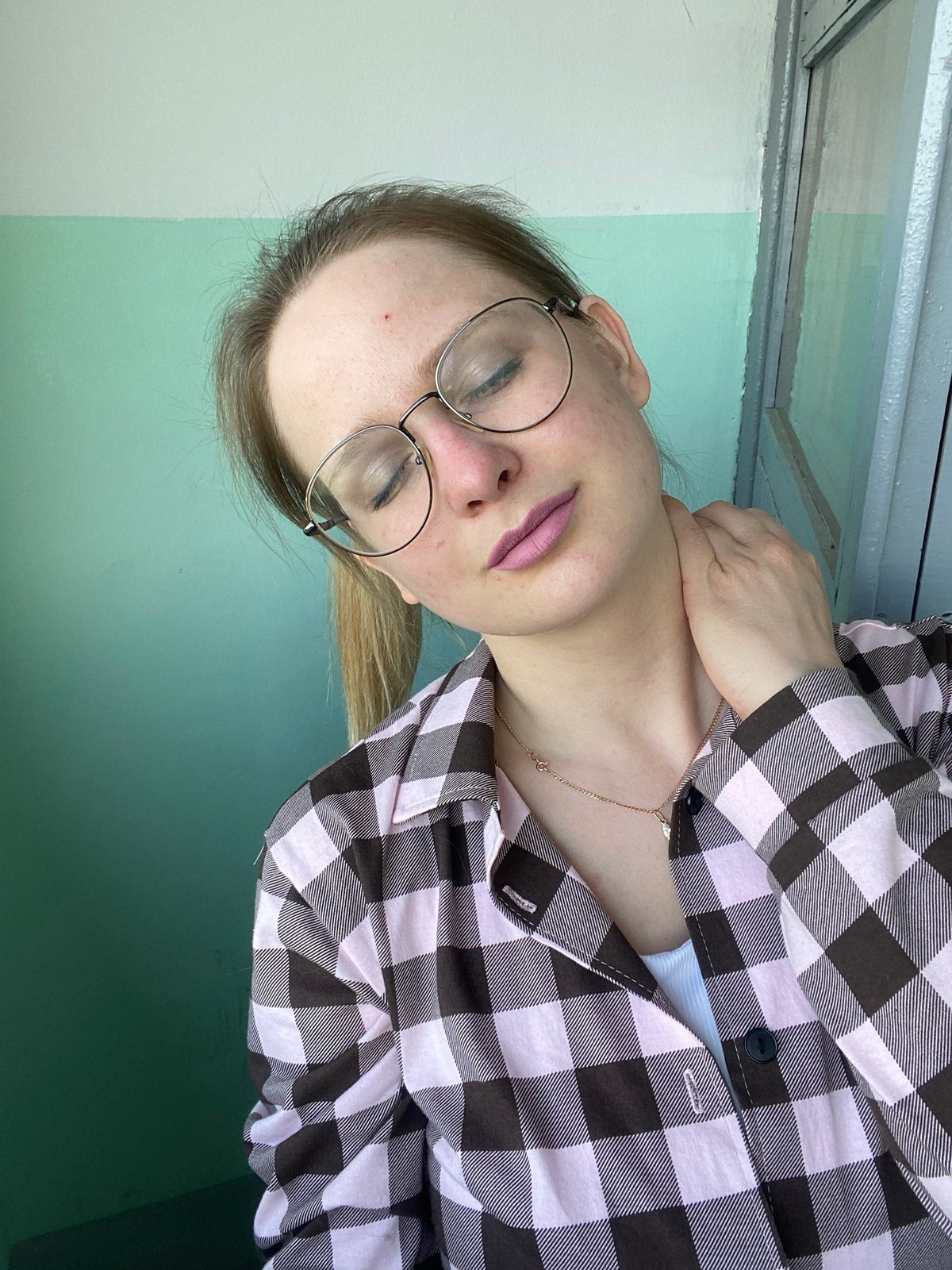 Blonde woman in checkered shirt documented in casual outdoor moments