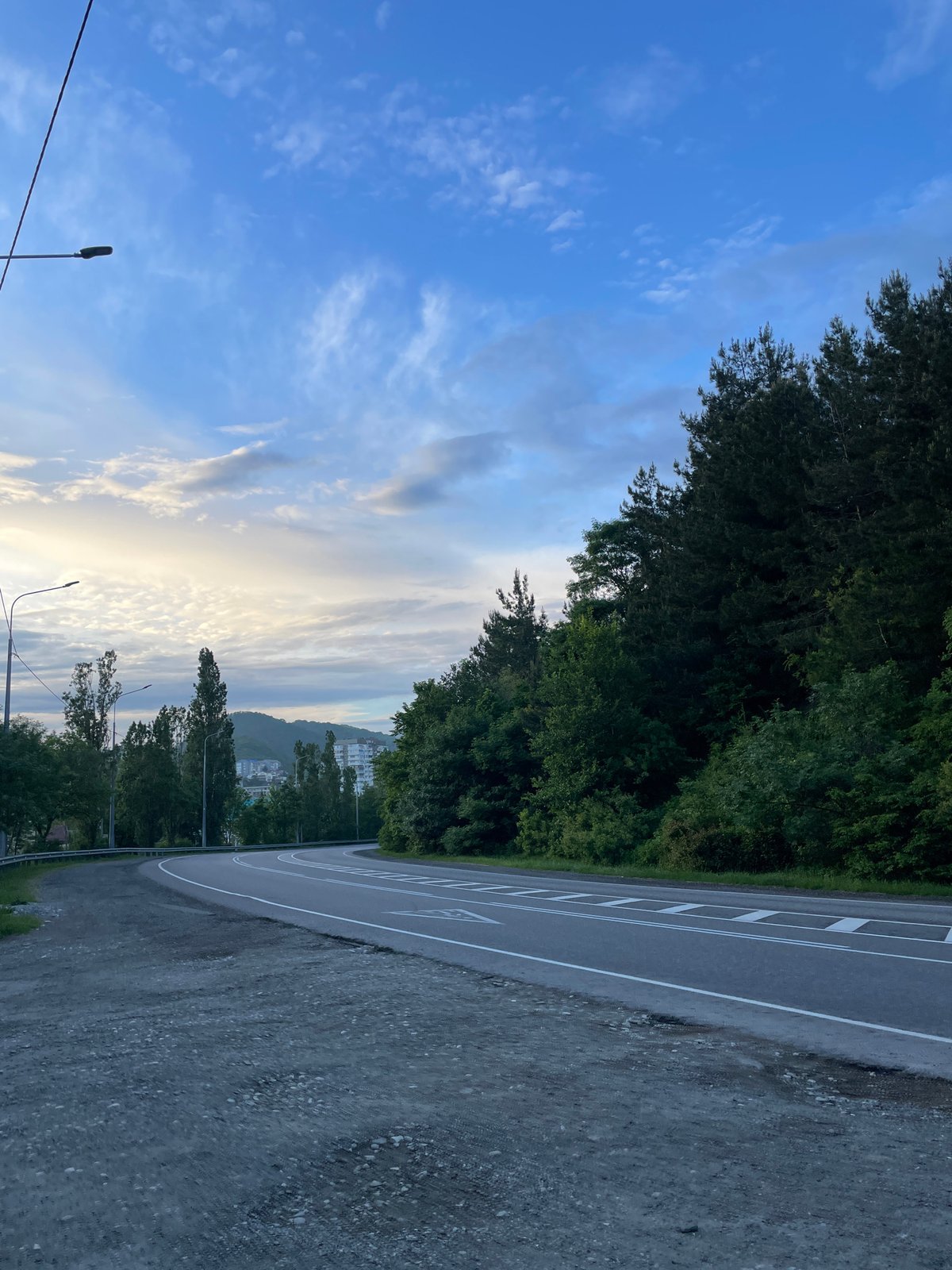 Daily life documented across Olginka's roads, paths, and coastline