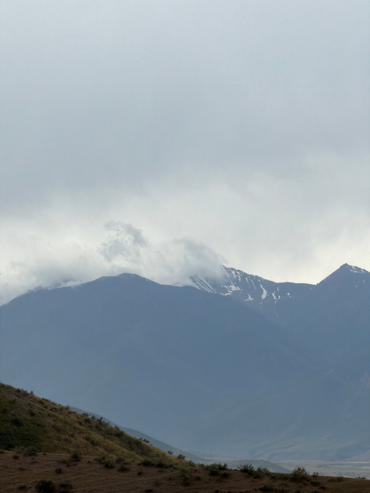Hiking and exploring a remote snow-capped mountain range