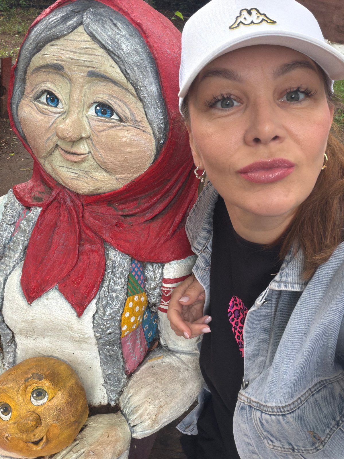 Posing with quirky statues and props in Chaikovsky