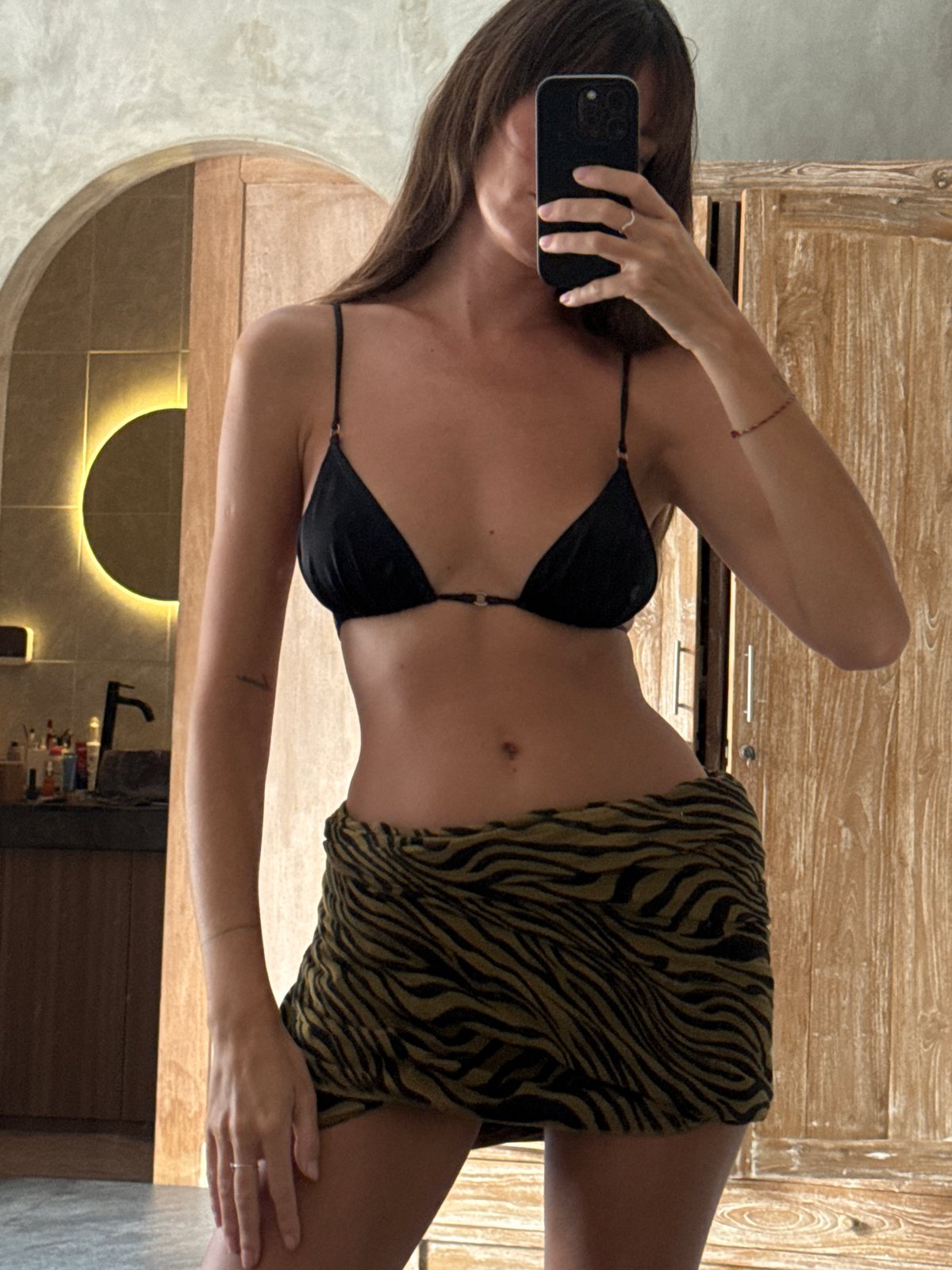 Woman Takes Mirror Selfie in North Kuta Bathroom
