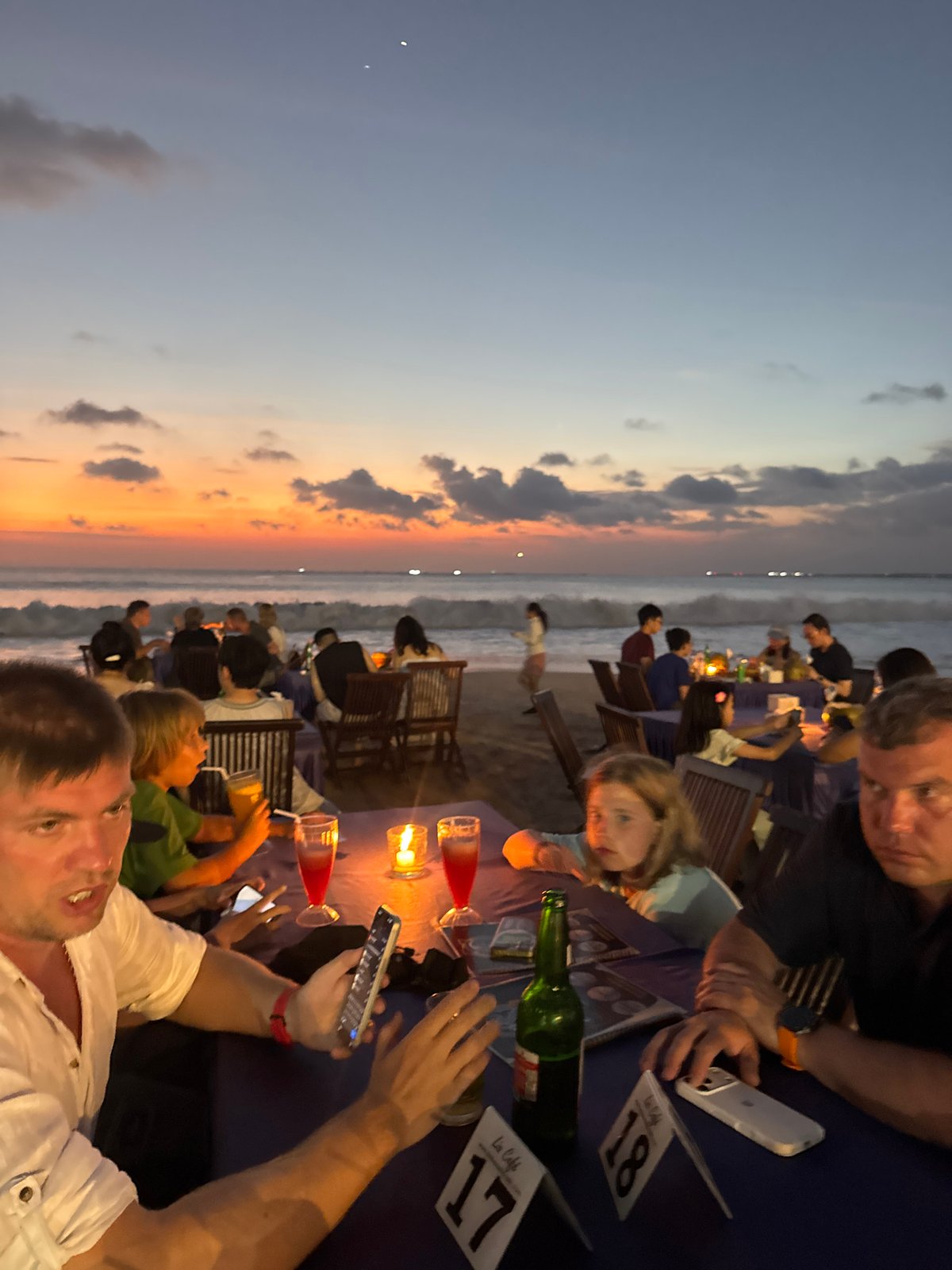 Beachside sunset dining scene unfolds in Kuta Selatan, Indonesia
