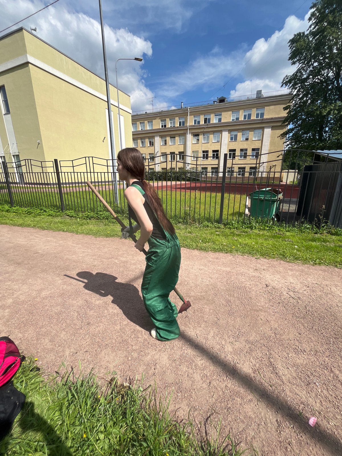 Park maintenance worker tends gardens in Saint Petersburg