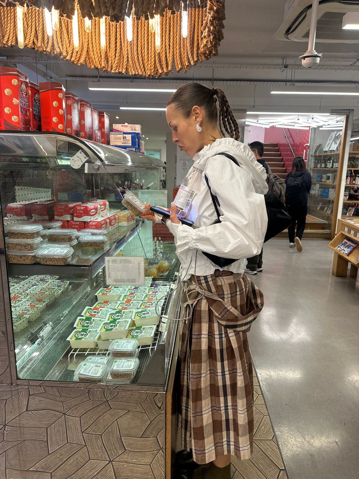 Shopper browses Japanese specialty items at London grocery store