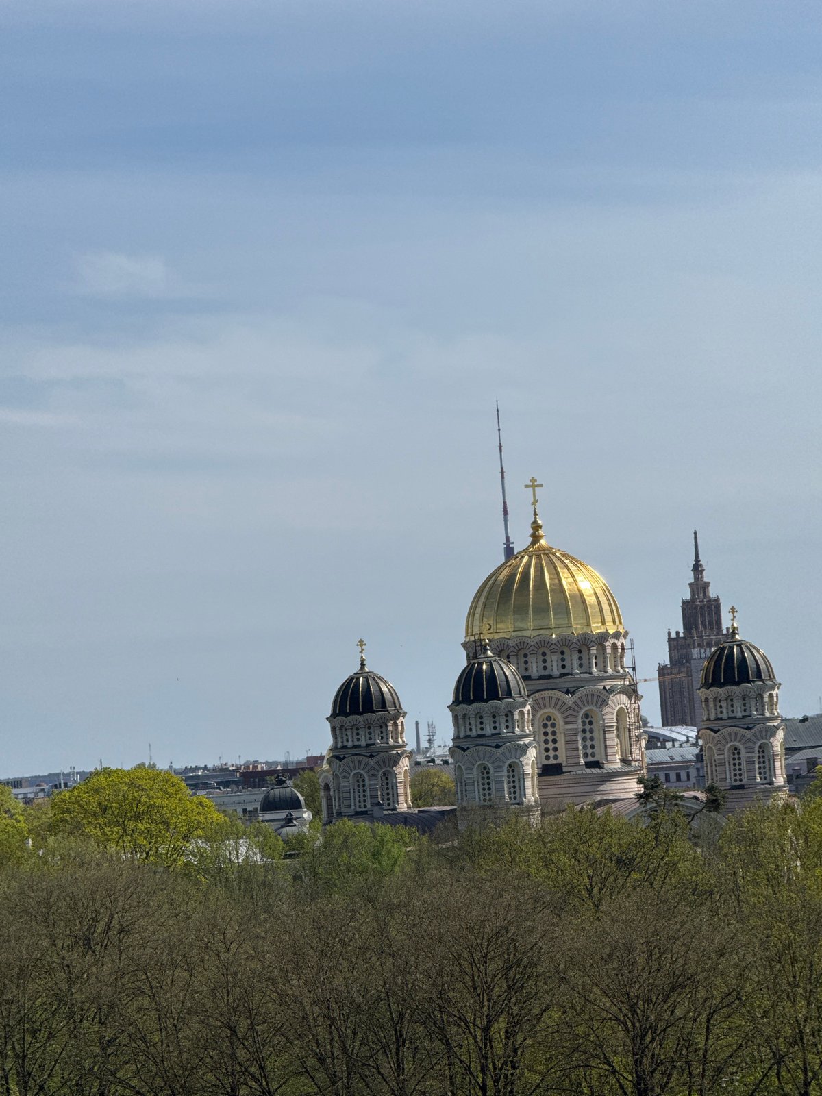 Witness documents Riga cityscape from elevated viewpoint featuring Orthodox cathedral