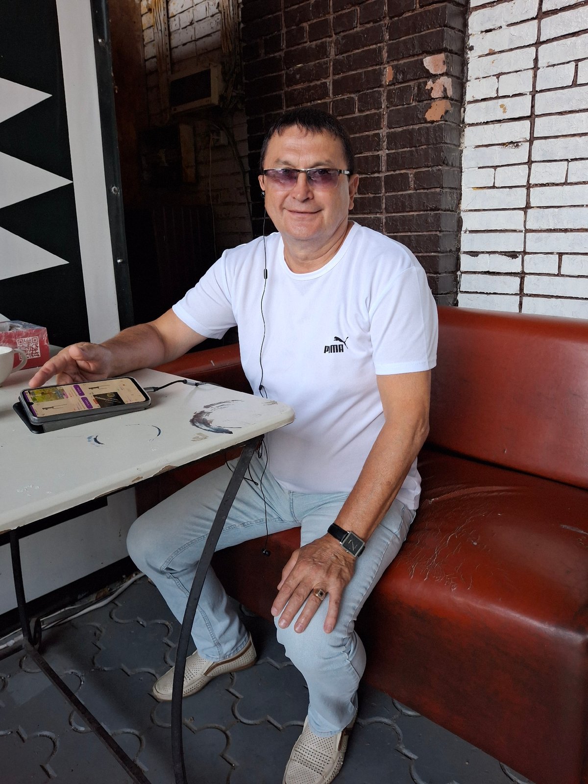 Relaxed moment on a red bench in Rostov-on-Don
