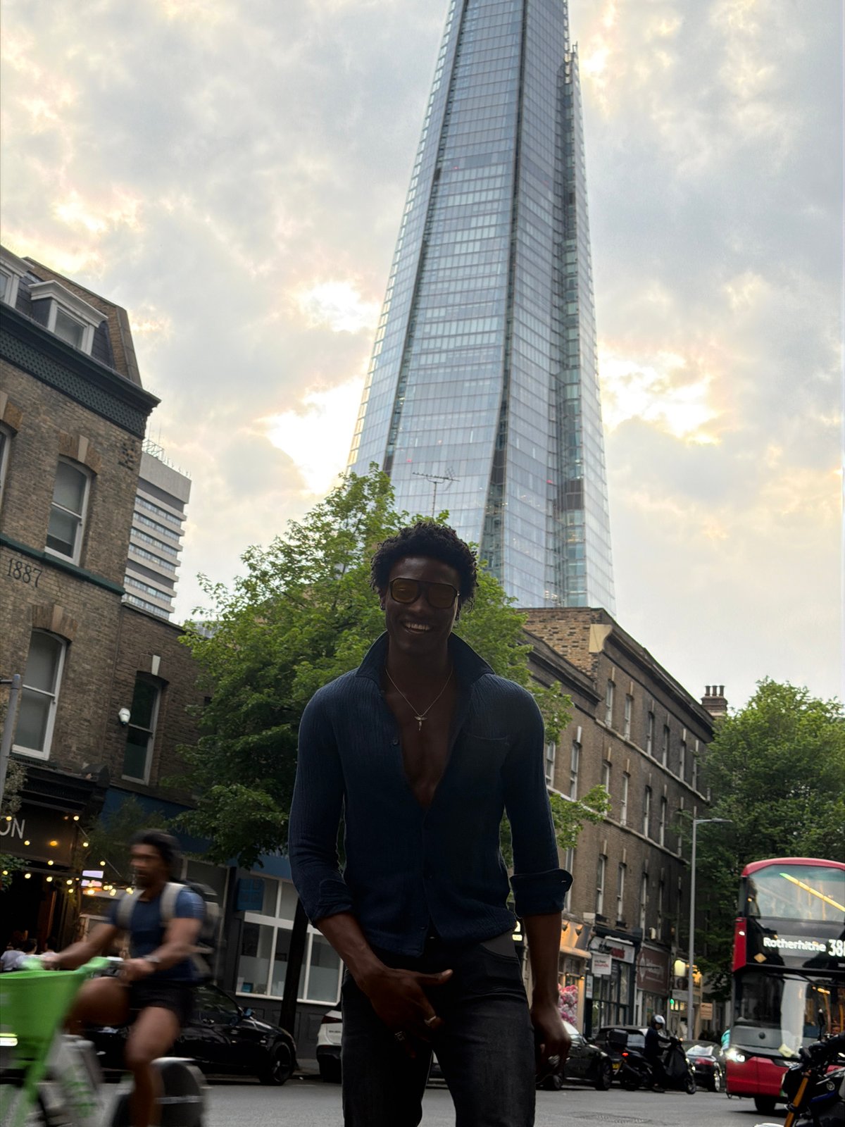 Person photographed amid busy London street scene