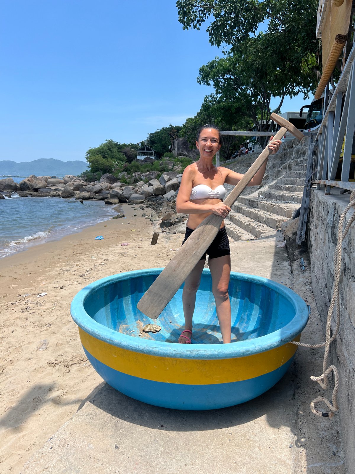 Nha Trang coastline: boats, boulders, and a big banyan tree