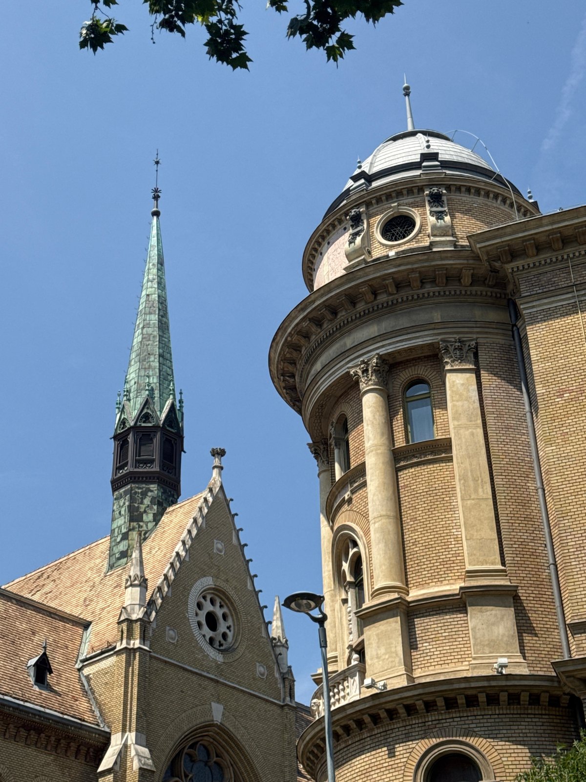 Budapest street-level architecture and a Mercury statue