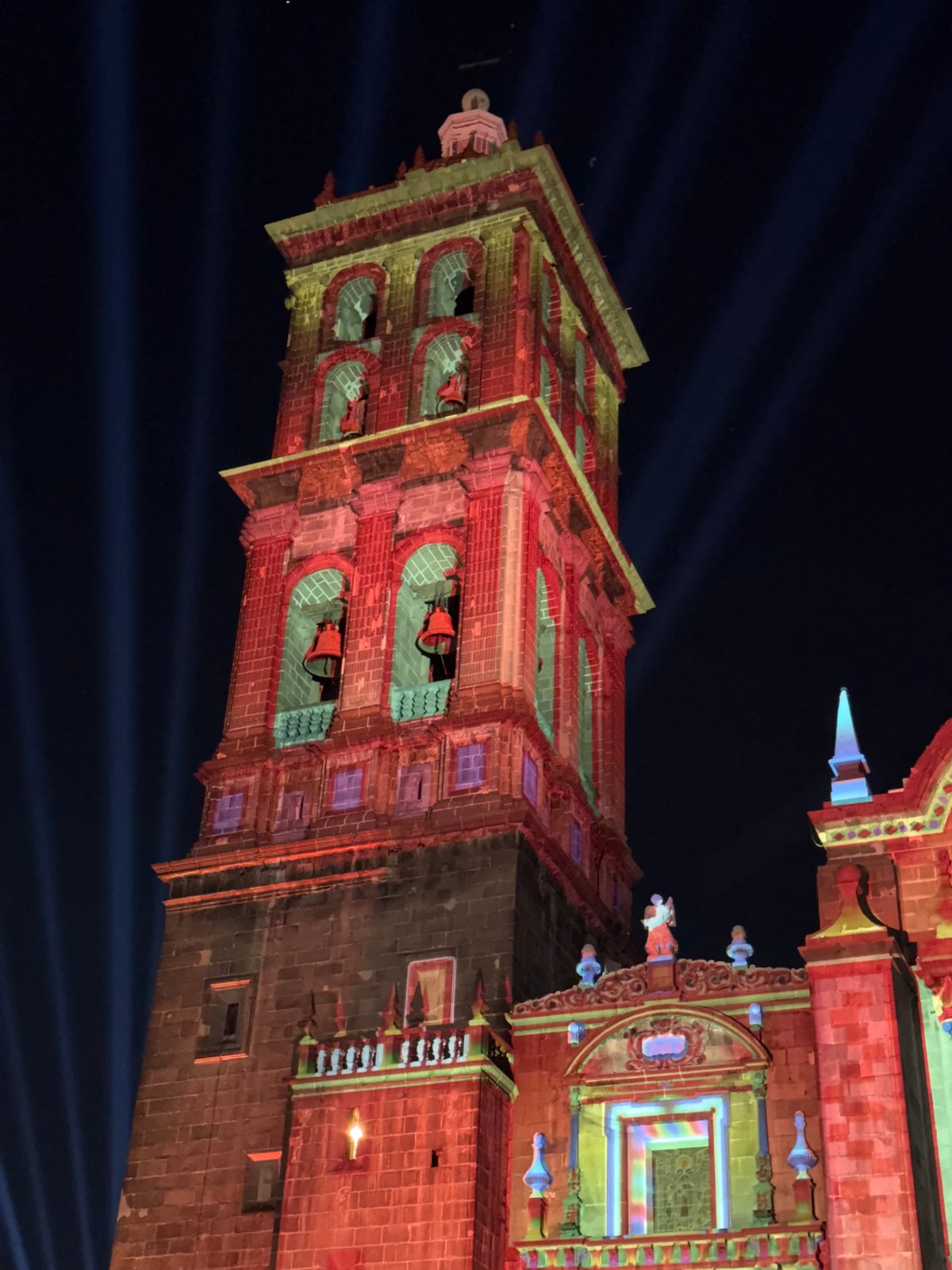 Church in Puebla illuminated with colorful lights at night