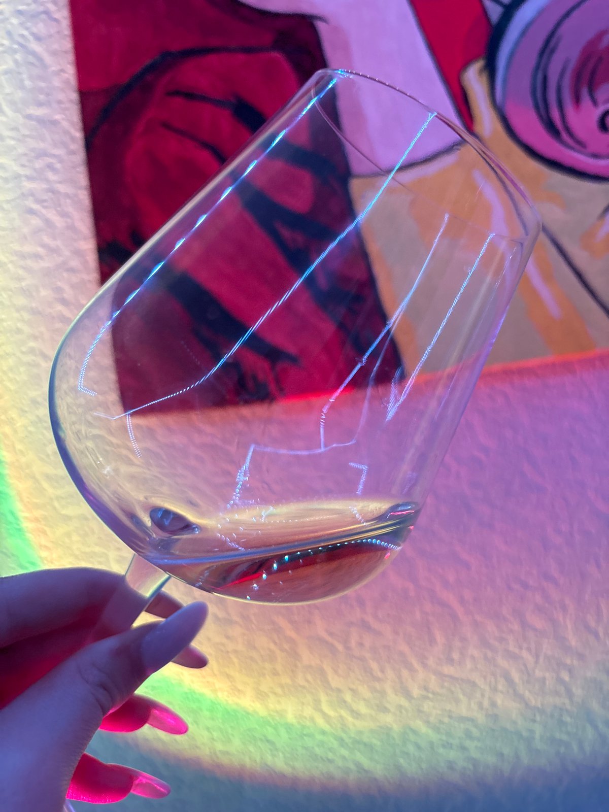 Wine glass and pink camera captured in Russian location