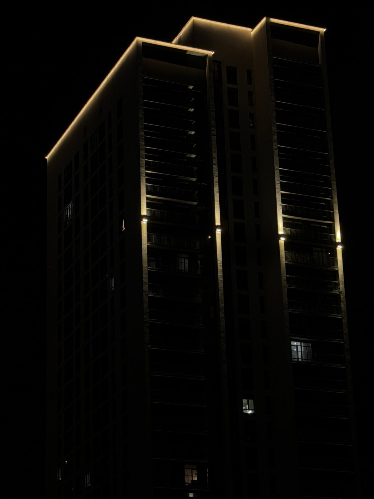 Modern Yekaterinburg building lit up at night