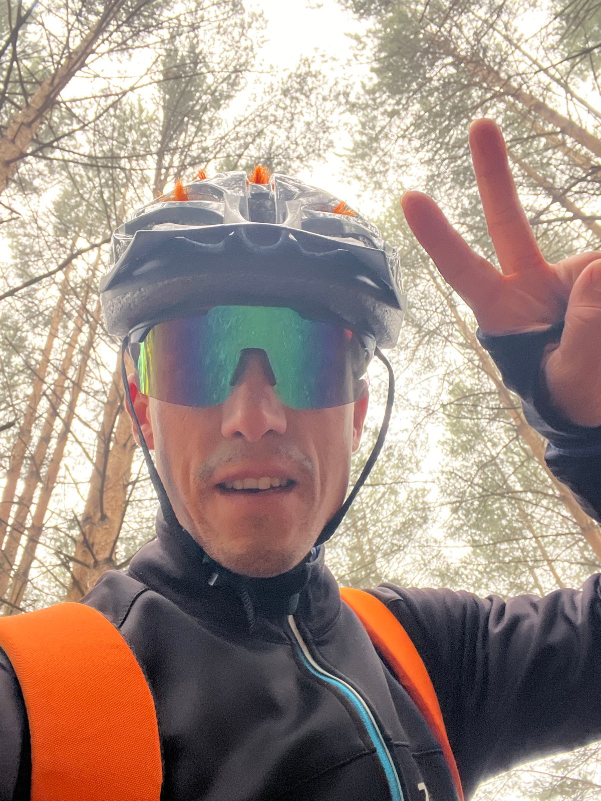 Cyclist photographed from unusual angles during forest ride in Russia