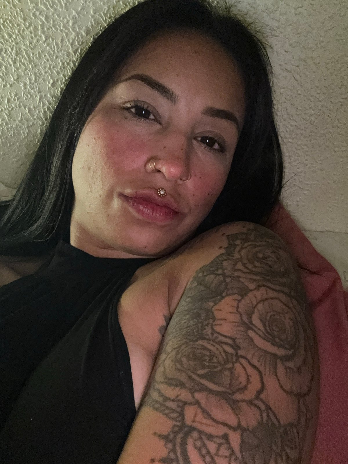 Woman with tattoos and piercings resting in Murcia