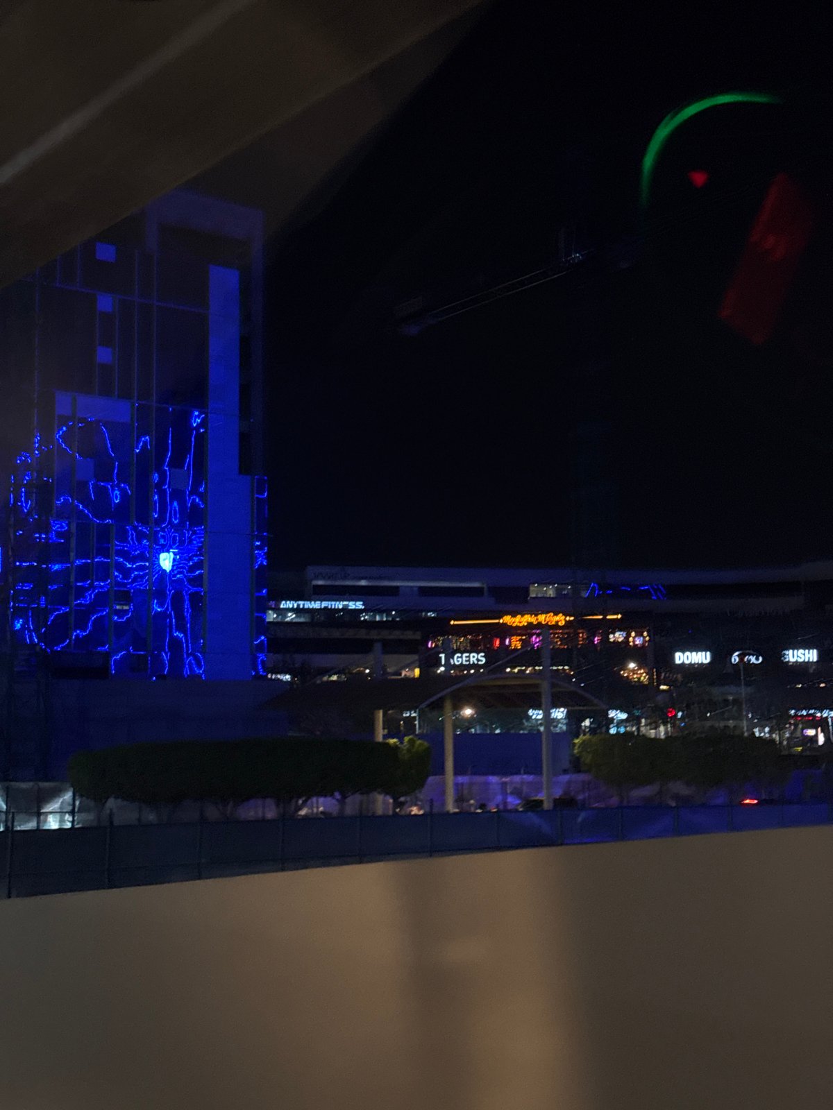 Nighttime commercial district illuminated in Puebla, Mexico