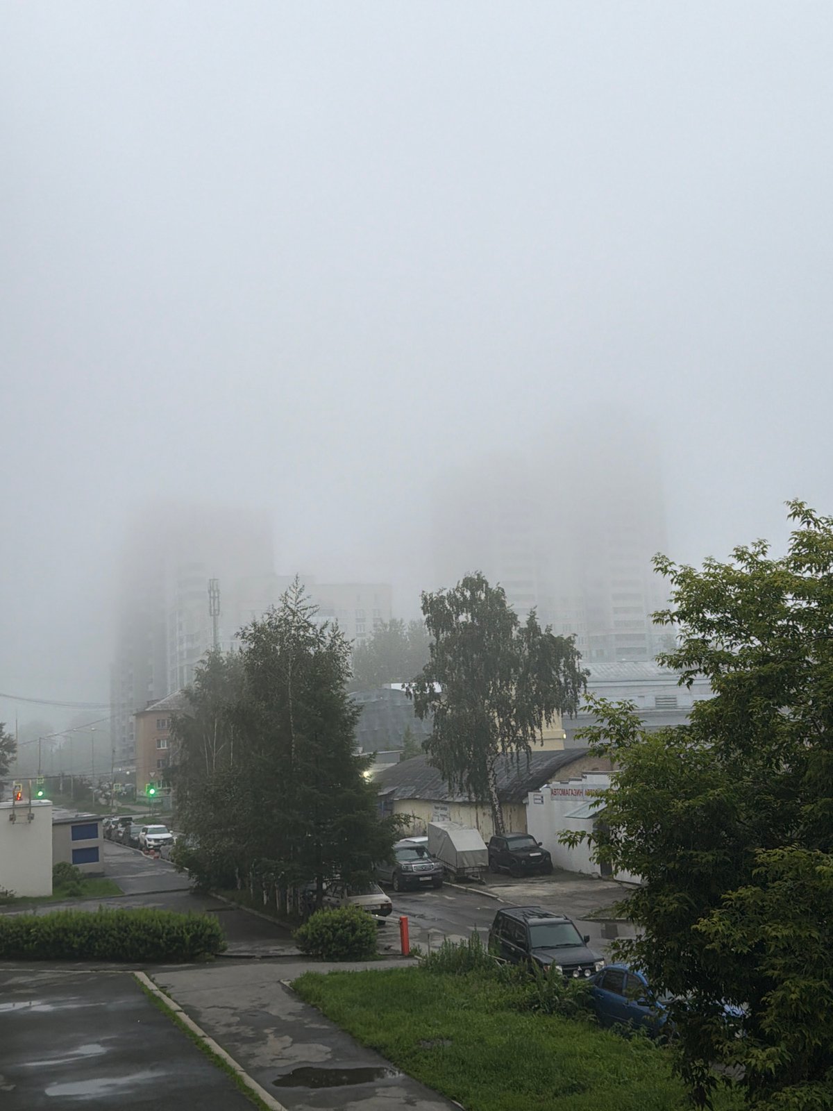 Dense fog shrouds Yekaterinburg streets after rain