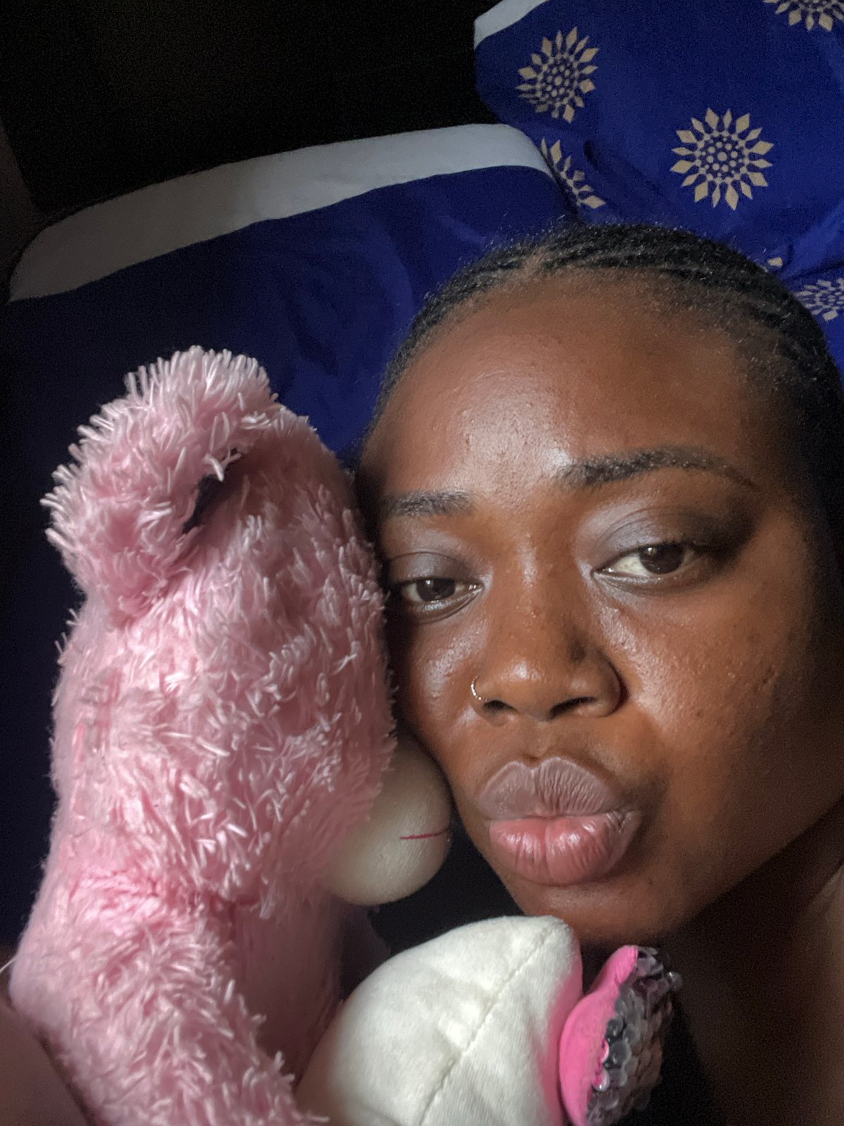 Woman photographed in bedroom portrait series in Abuja