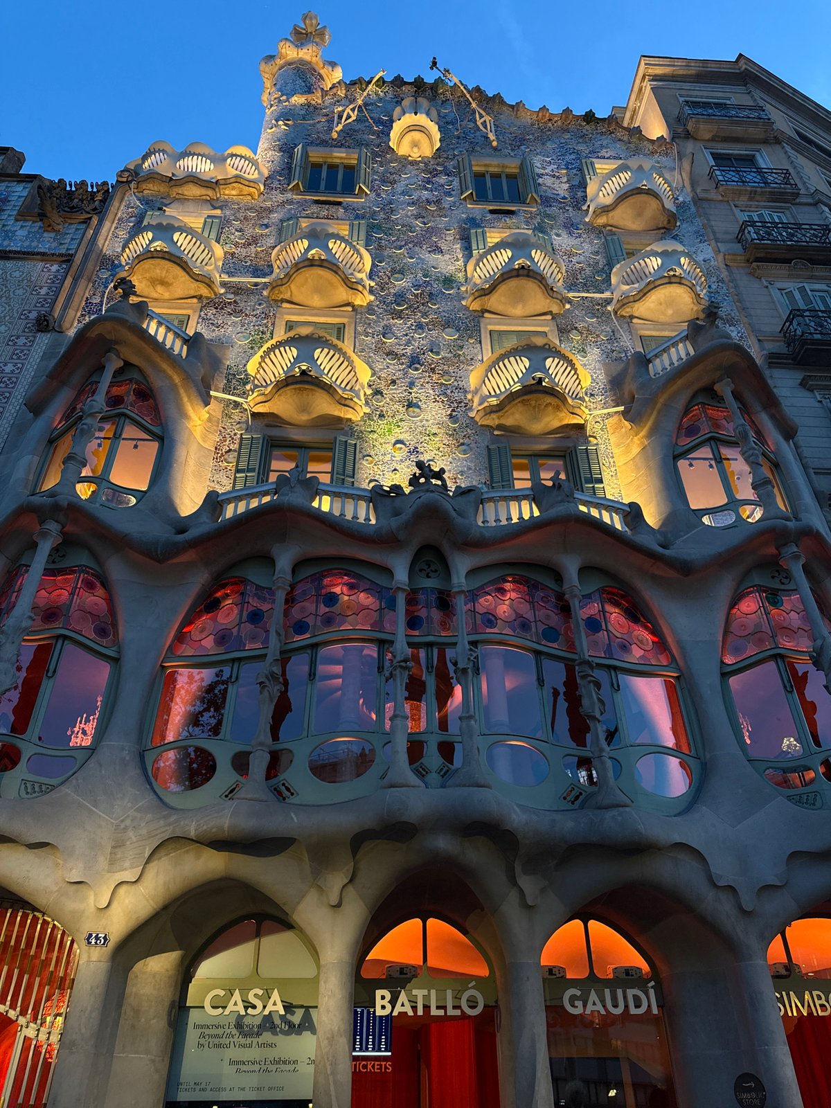 Evening documentation of Gaudí's Casa Batlló facade in Barcelona