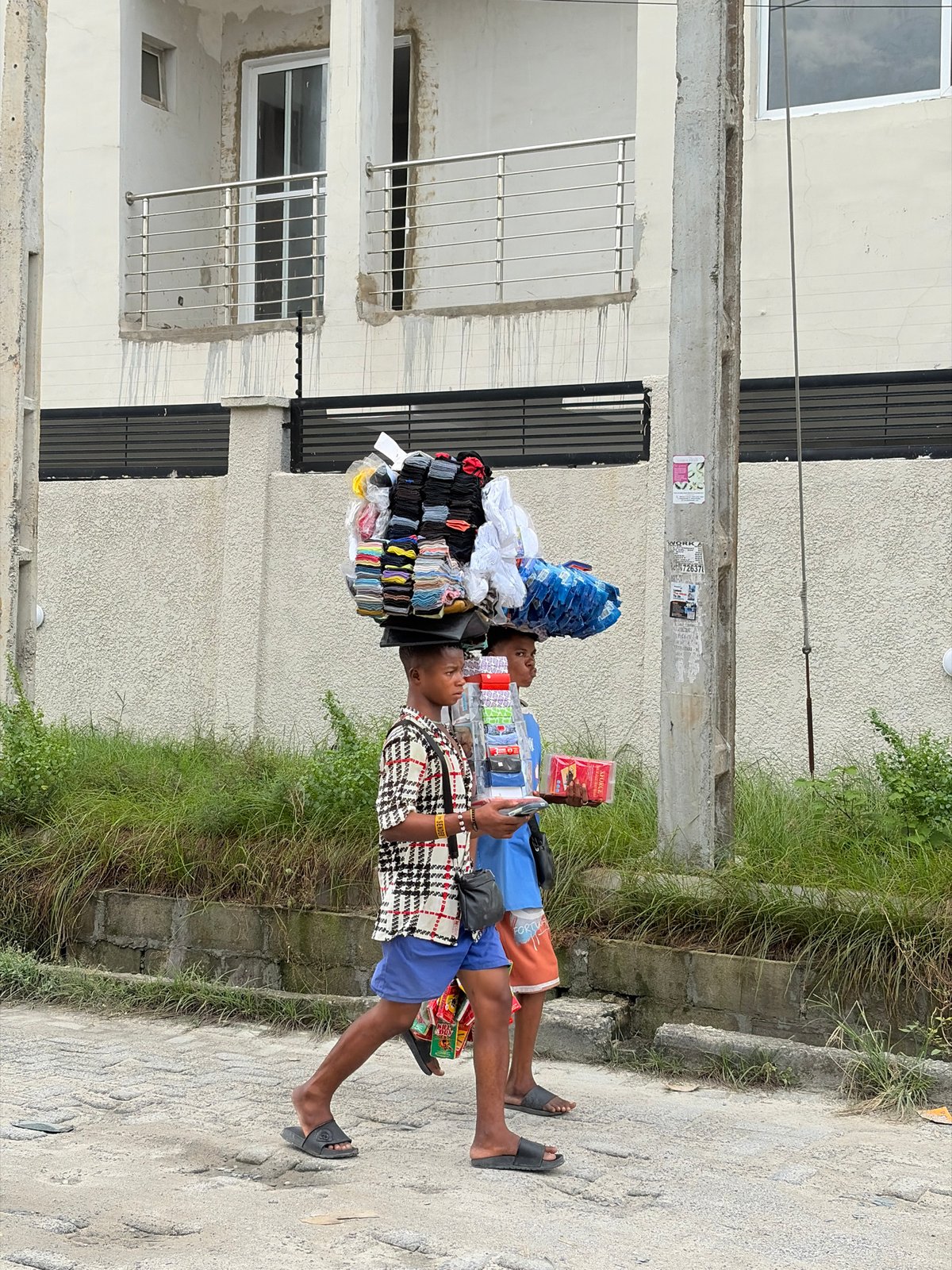 Street commerce and deliveries moving through Igboefon, Lagos