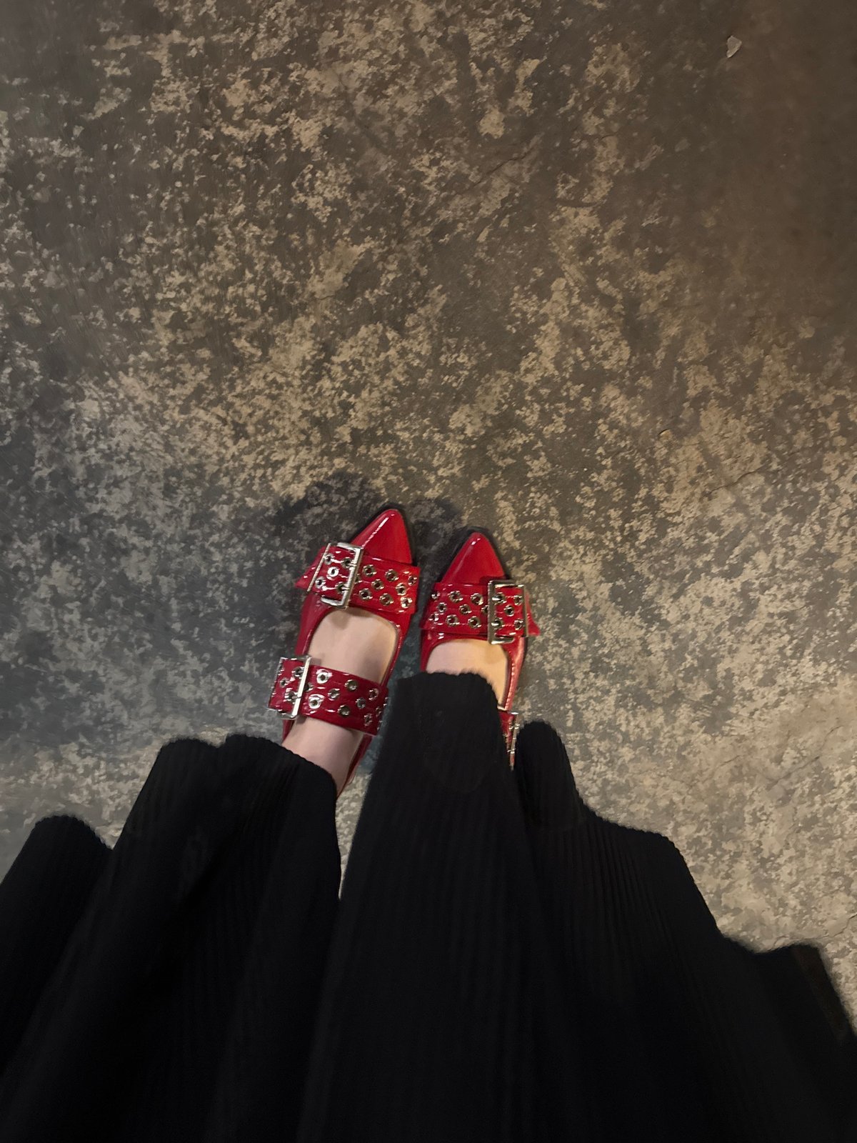 Woman in red shoes takes elevator selfie in Mexico City