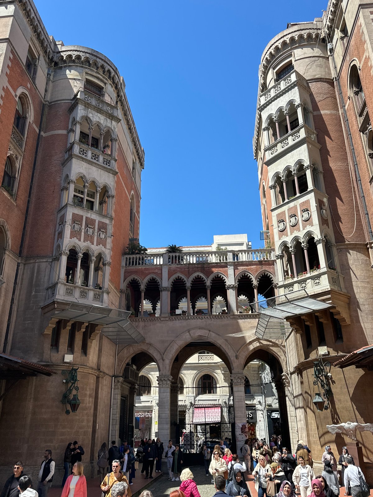 Tourist documents historic church architecture in Istanbul's Beyoğlu district