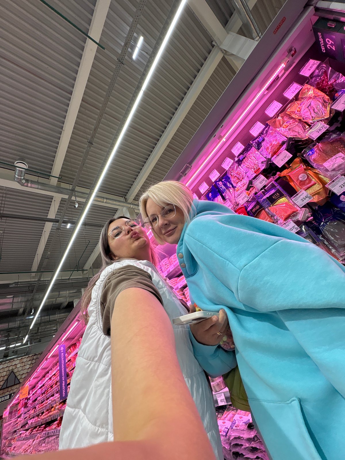 Women document casual shopping trip with selfies in Birobidzhan supermarket