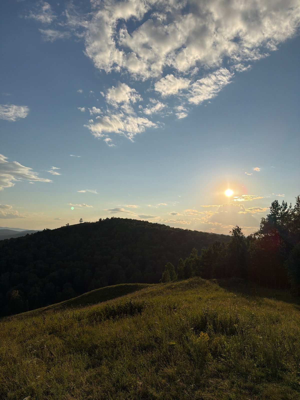 Sunset over Krasnoyarsk's forested hills and valley