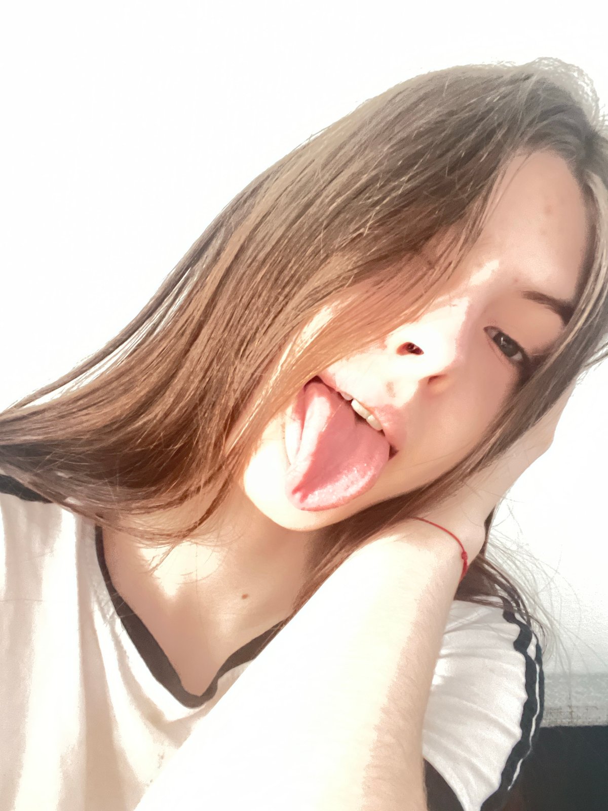 Woman takes playful selfies in Saint Petersburg morning
