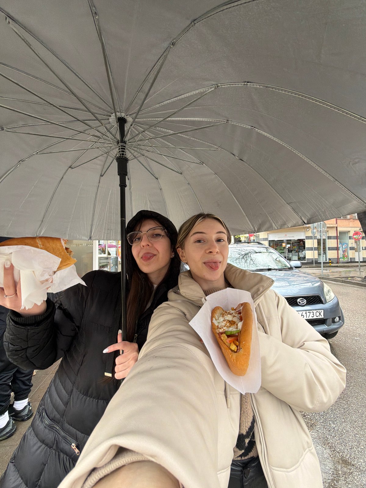 Women share lunch under umbrella in Plovdiv