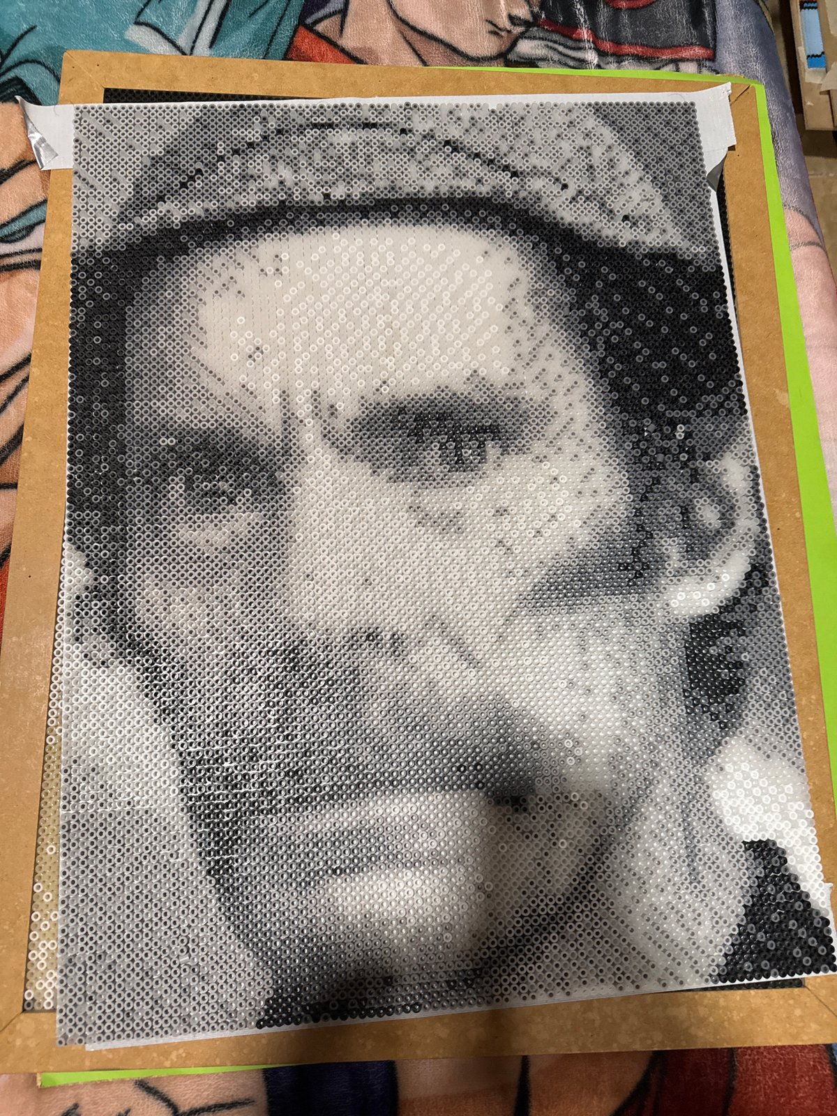 Artist completes intricate bead portrait in early morning Puebla session