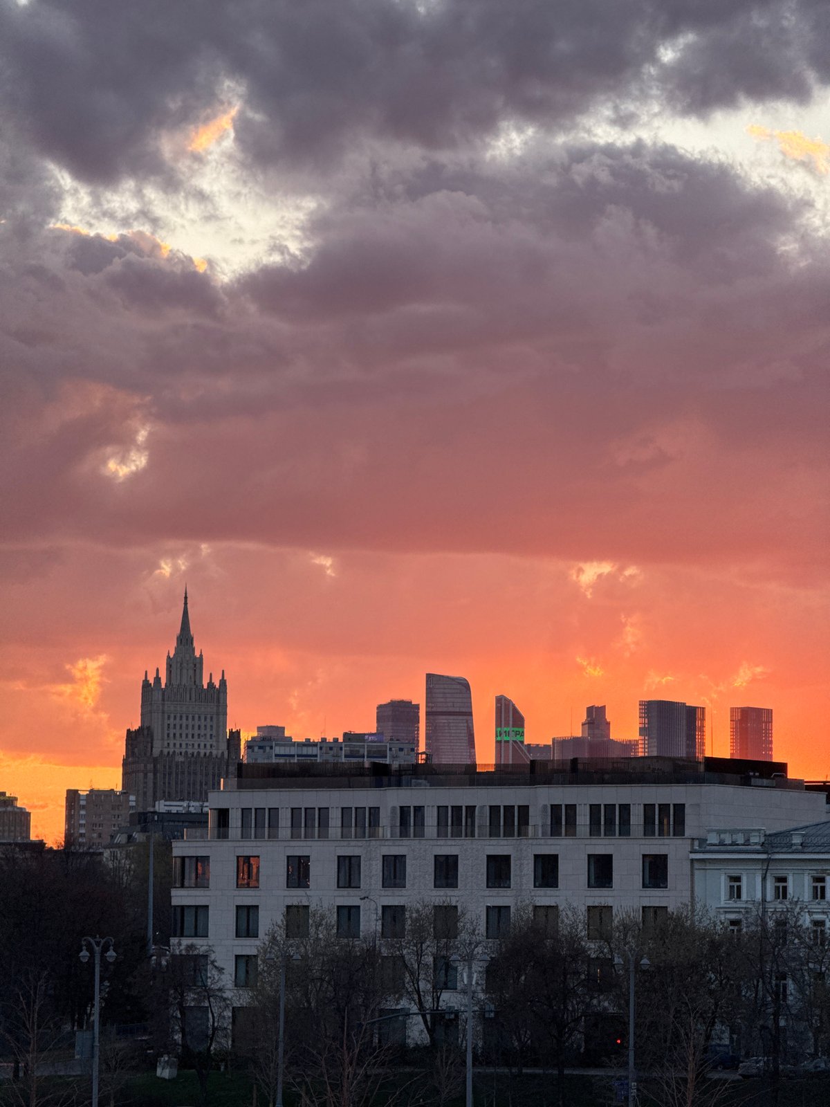 Sunset cityscape documented with dramatic sky color transition