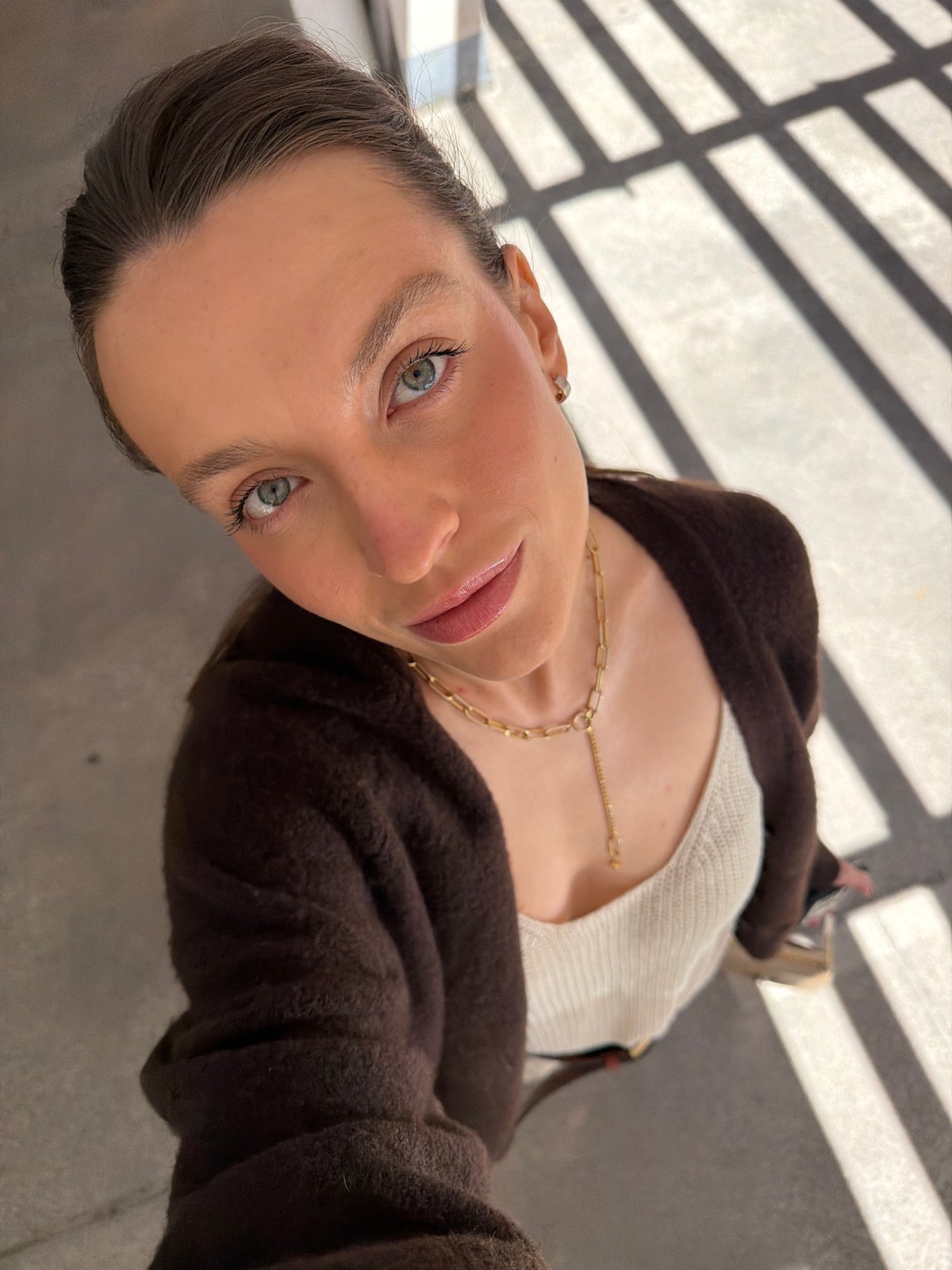 Woman takes selfies in indoor locations around Budva