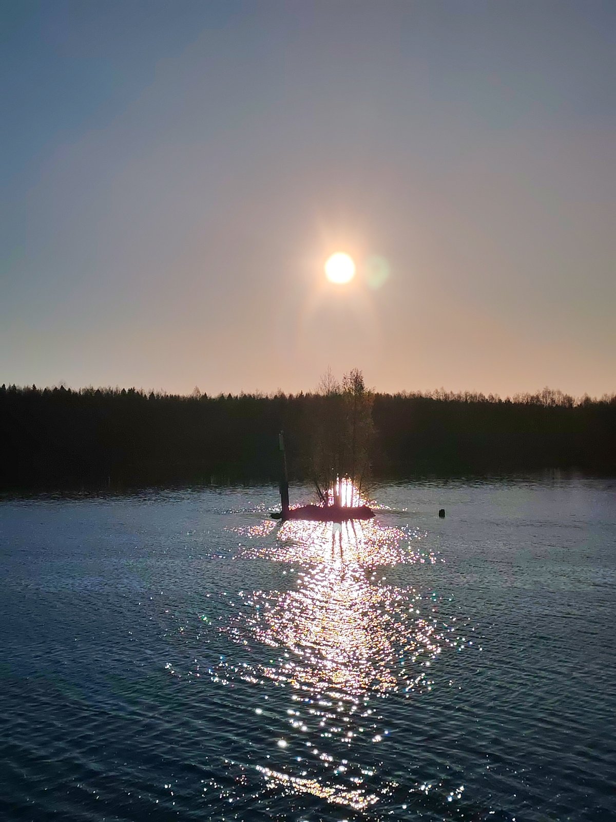 Sunset captured over Russian waterway near Kurdiug