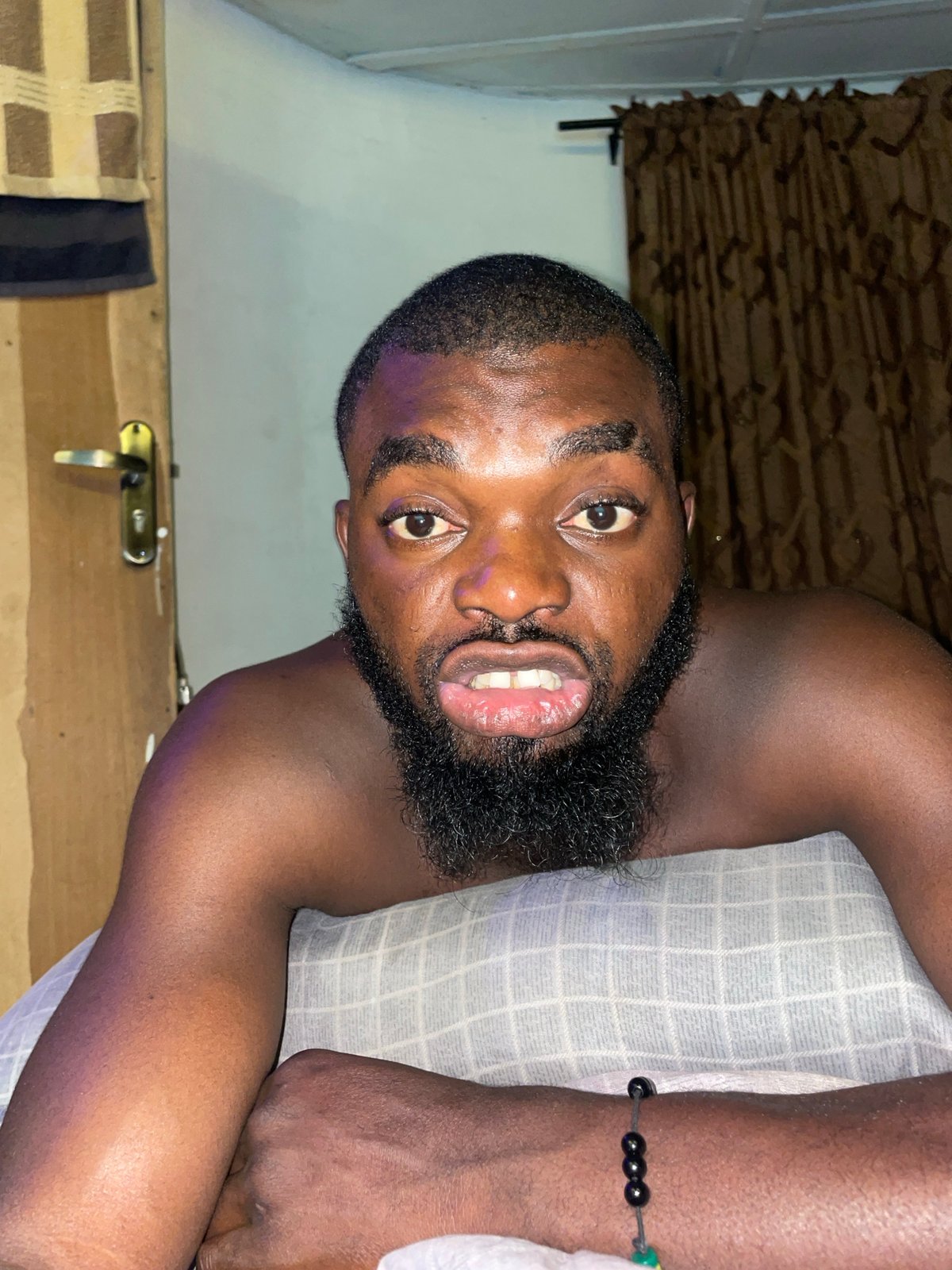 Man with remote and local shops captured in Jos Nigeria