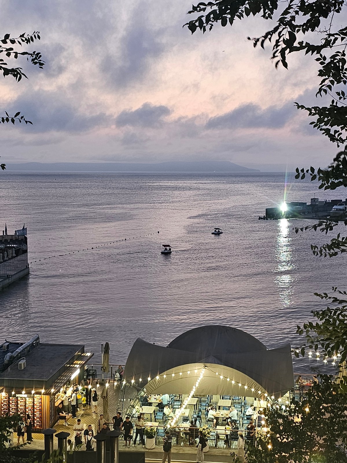 Vladivostok waterfront at dusk, harbor and Ferris wheel
