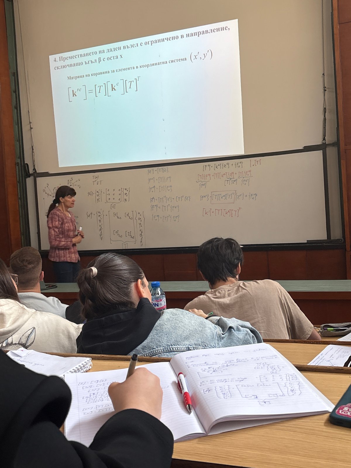 Professor delivers morning lecture with equations in Sofia classroom
