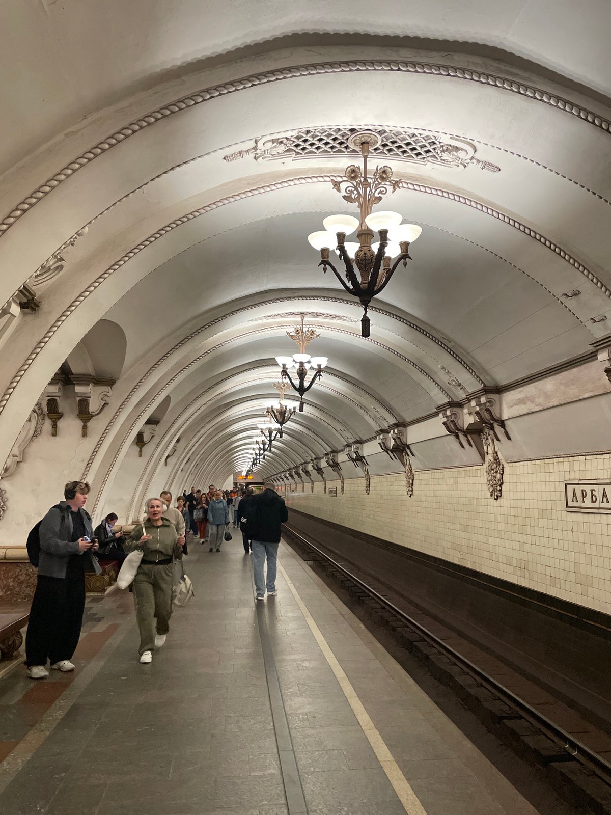 Early morning commute captured at ornate Moscow Metro stations