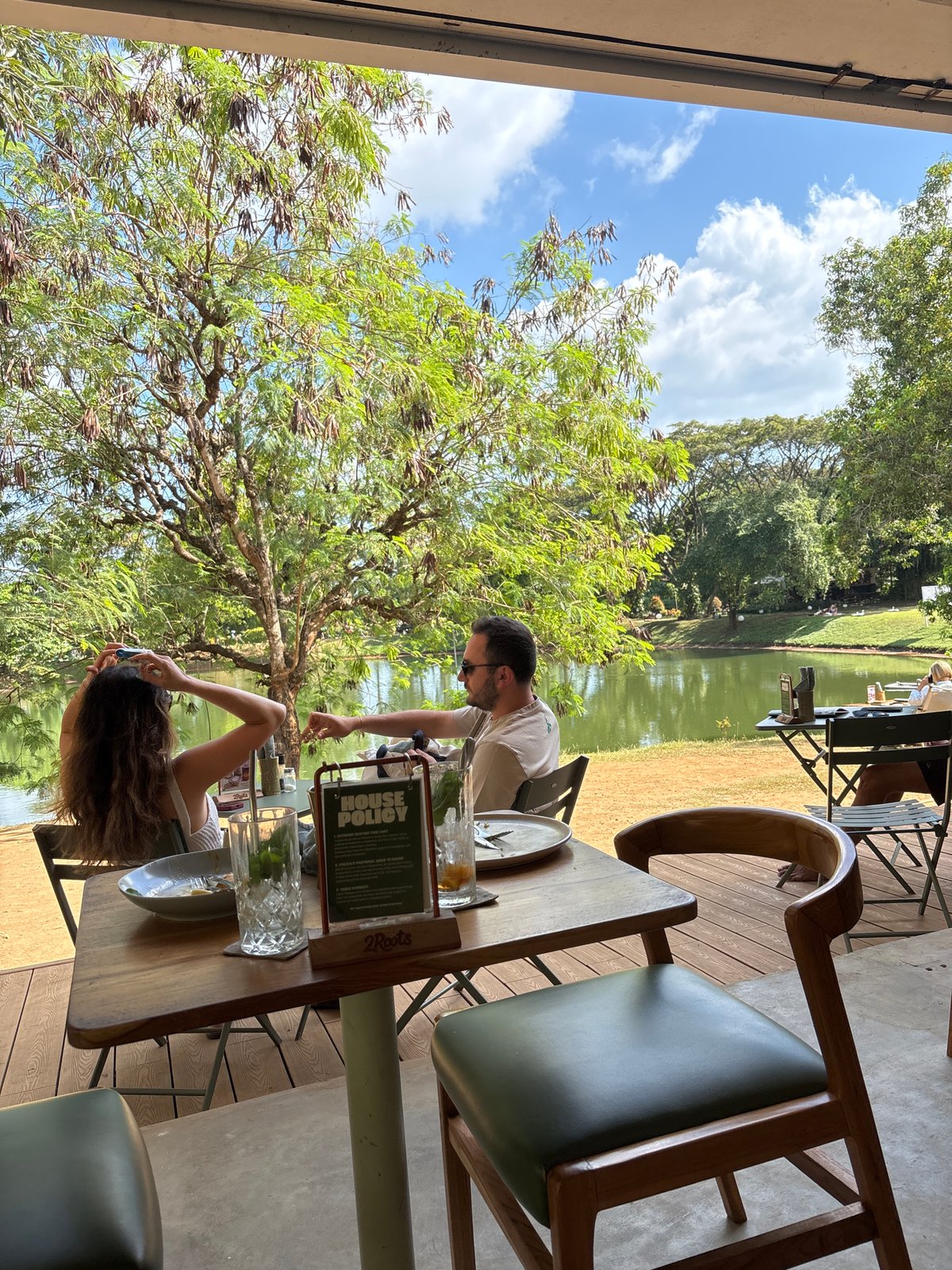 Outdoor dining captured at waterside resort in Kuta Selatan