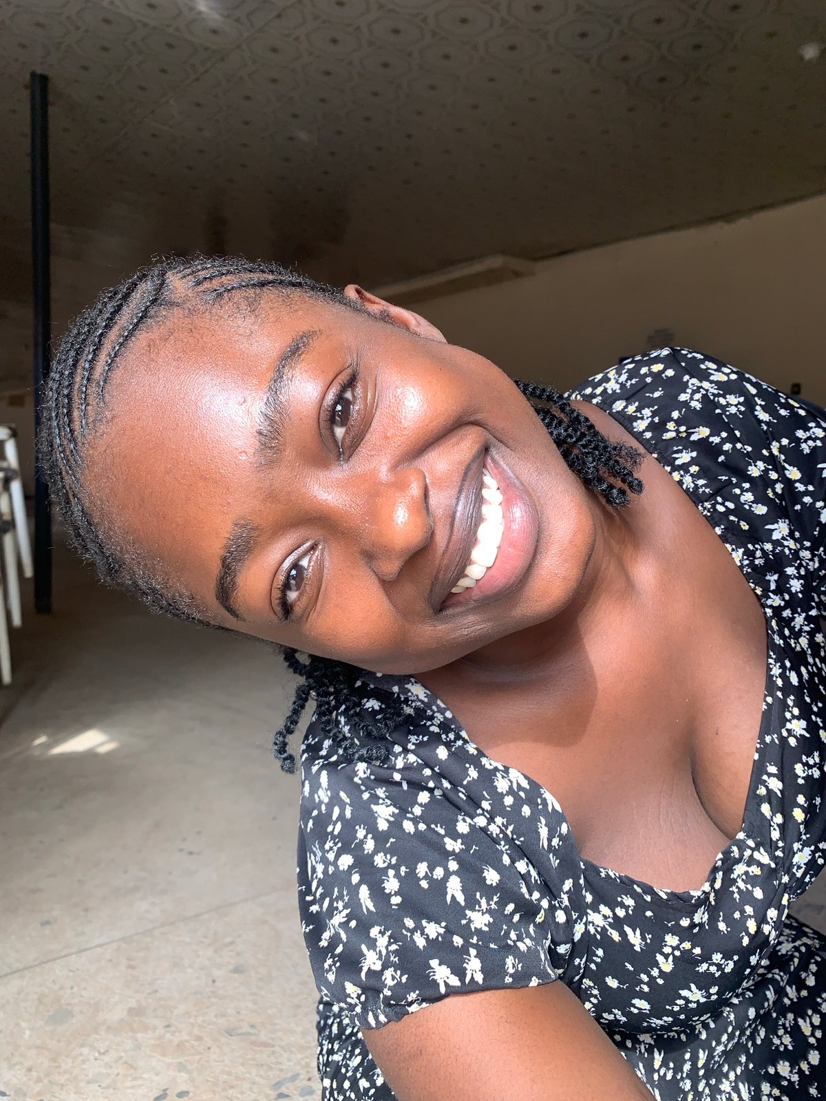 Afternoon gathering documented at Nigerian stadium with food and drinks
