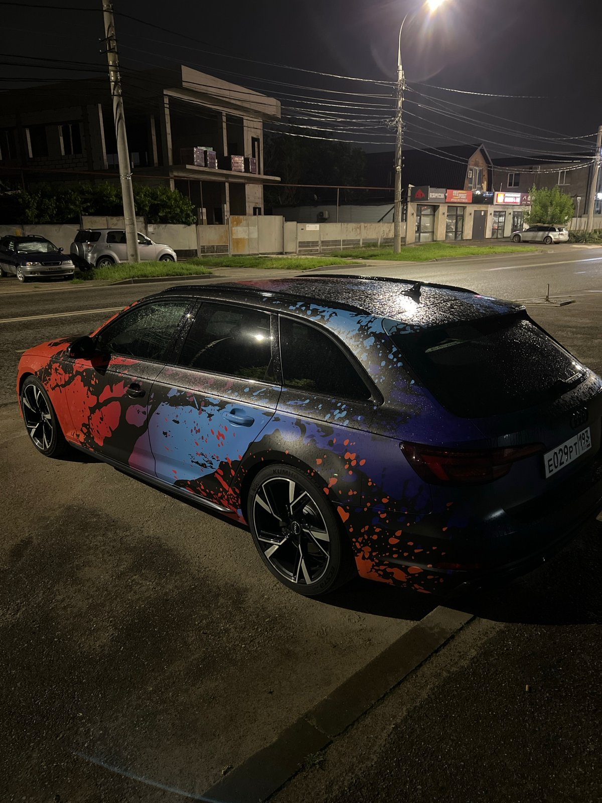 Custom-painted cars spotted on wet Krasnodar streets at night