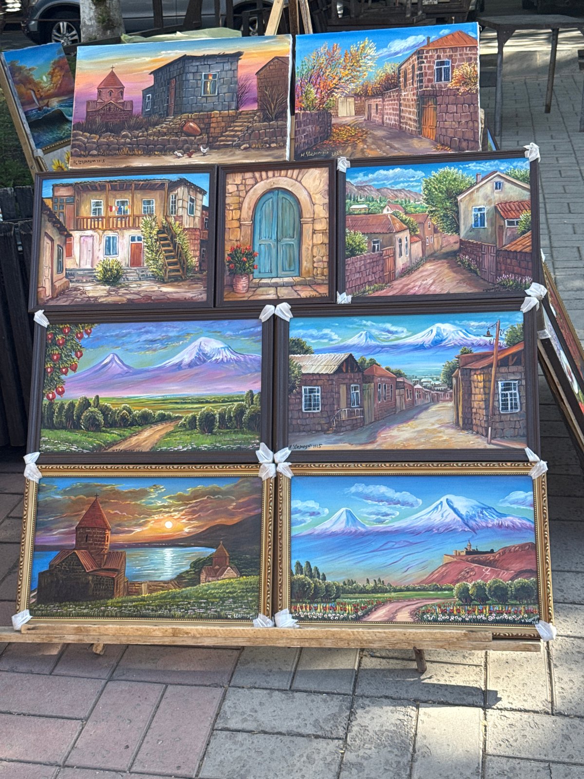 Street art vendor displays landscape paintings in Yerevan