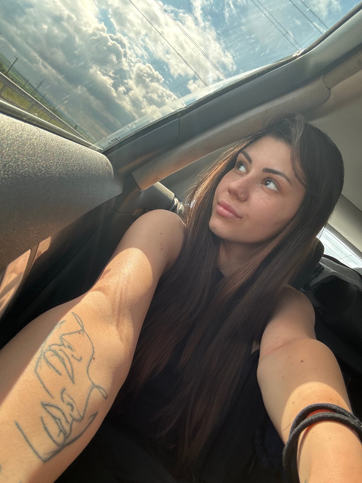 Woman documents car journey through Bulgarian countryside with selfies