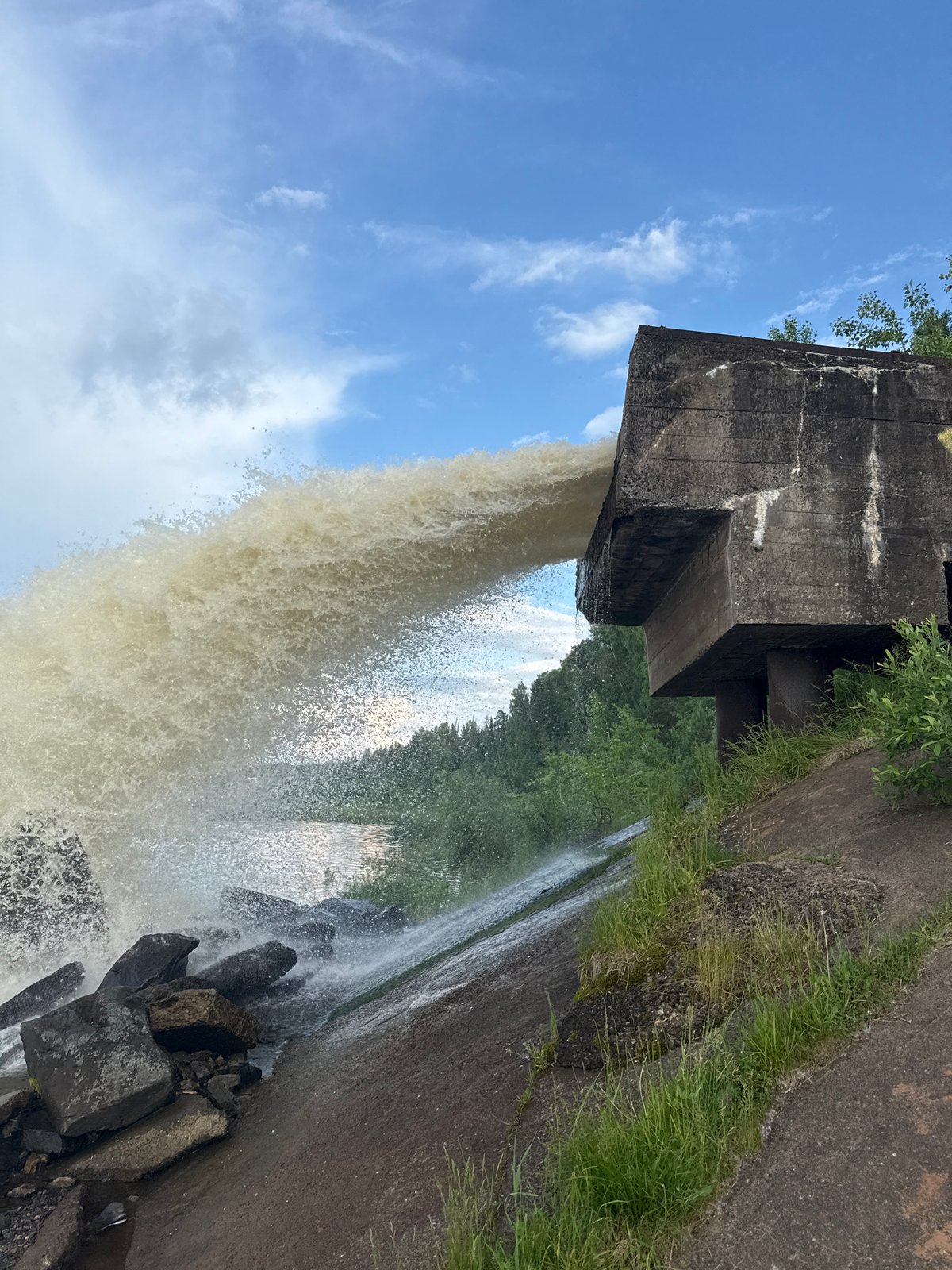 Water discharge and fishing activity near Chernushka, Russia