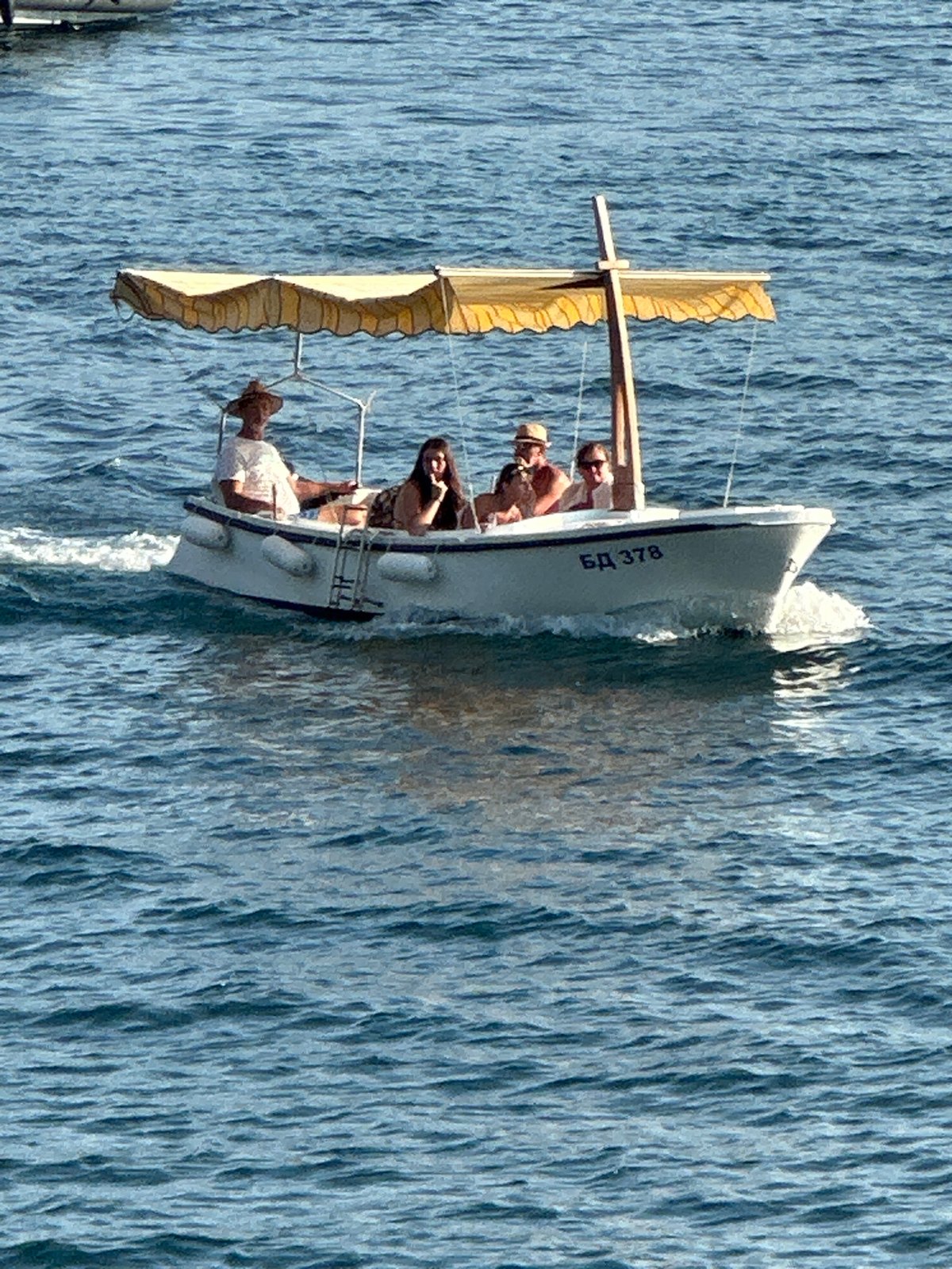 Boats and clear water off the Budva coast on a summer afternoon