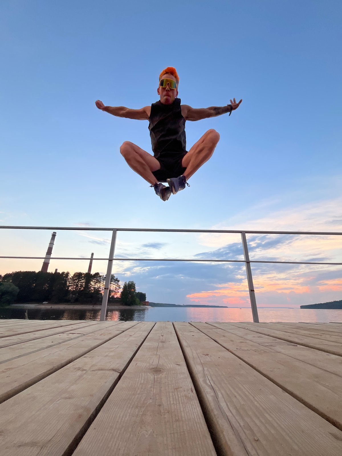 Sunset cycling session on Kama River pier in Chaikovsky