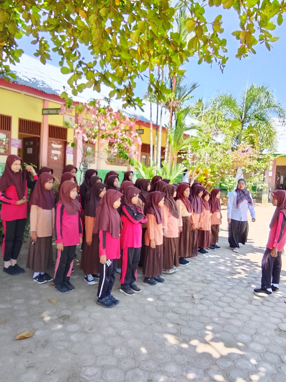 Islamic school students assembled in courtyard, Baratpayaitek, Indonesia